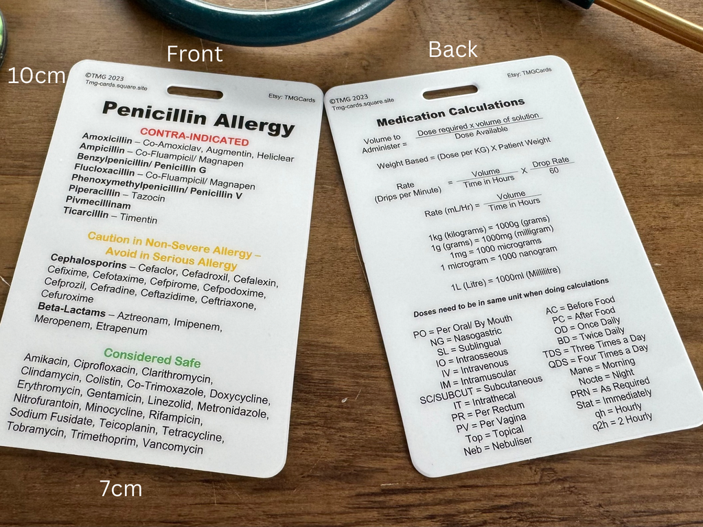 Front and rear of the Medication Calculations and Penicillin Allergy card laid on a wooden surface White measurement text overlays indicate 10cm and 7cm.
The front has Penicillin Allergy information and the rear has Medication Calculations Formulas and key abbreviations. TMG Cards